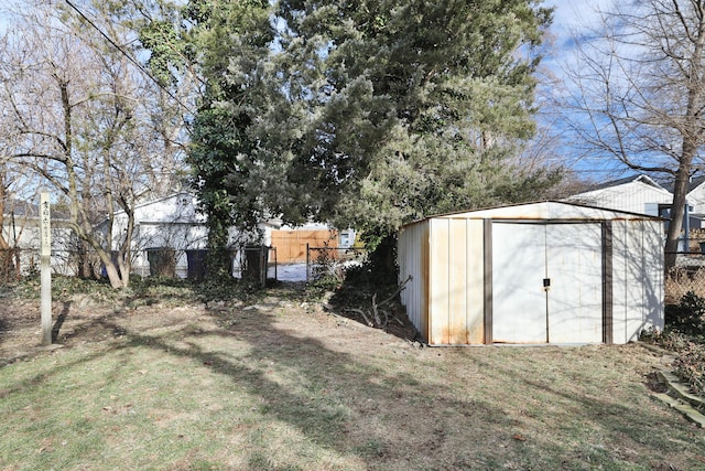 view of outbuilding with a yard