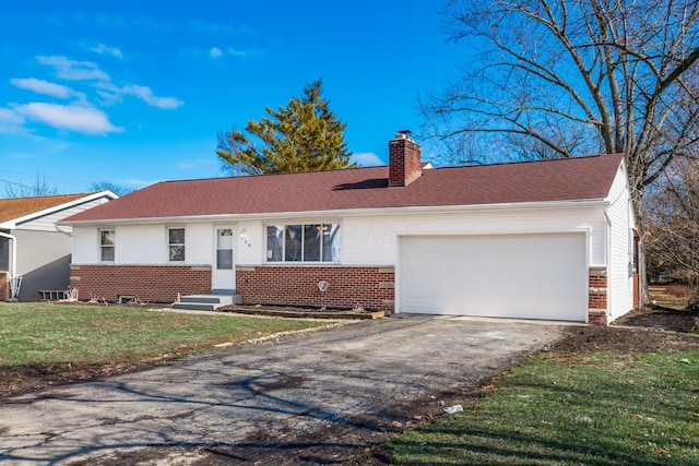 ranch-style home featuring a garage and a front yard