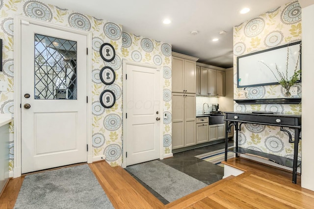 entryway featuring light hardwood / wood-style flooring and sink