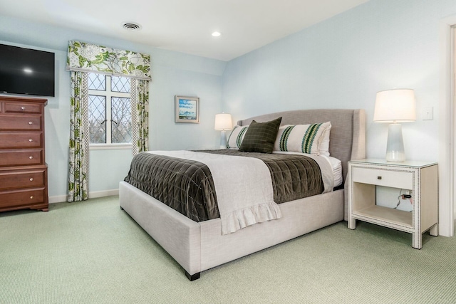 bedroom with light colored carpet