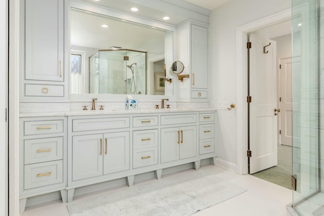 bathroom featuring an enclosed shower and vanity