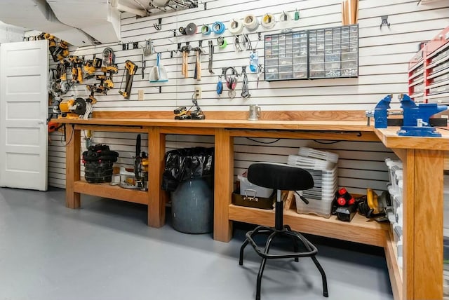 interior space with concrete floors and a workshop area