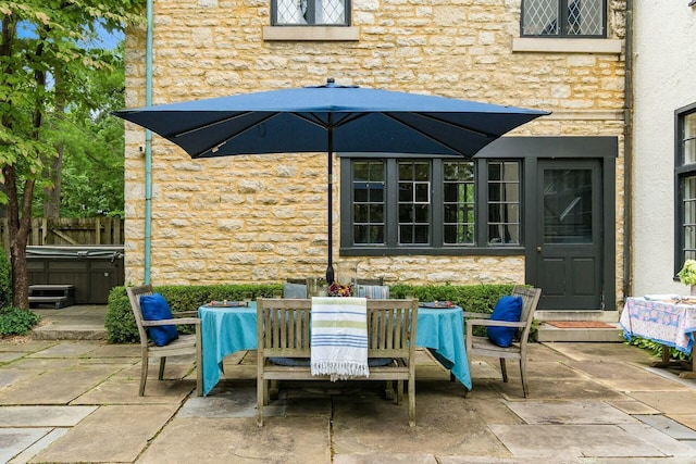 view of patio / terrace featuring a hot tub