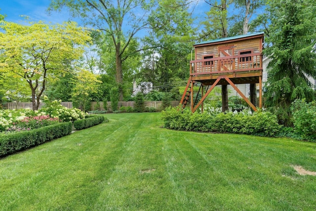 view of yard featuring a wooden deck