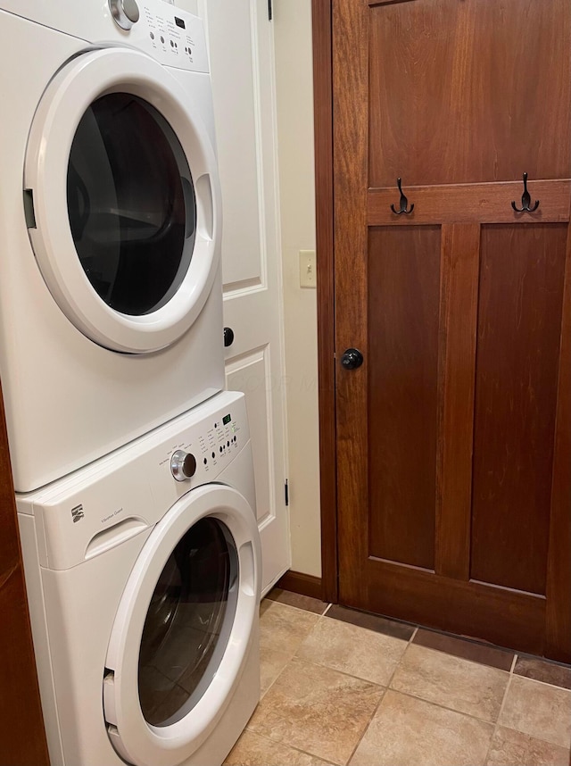 laundry room featuring stacked washer and dryer