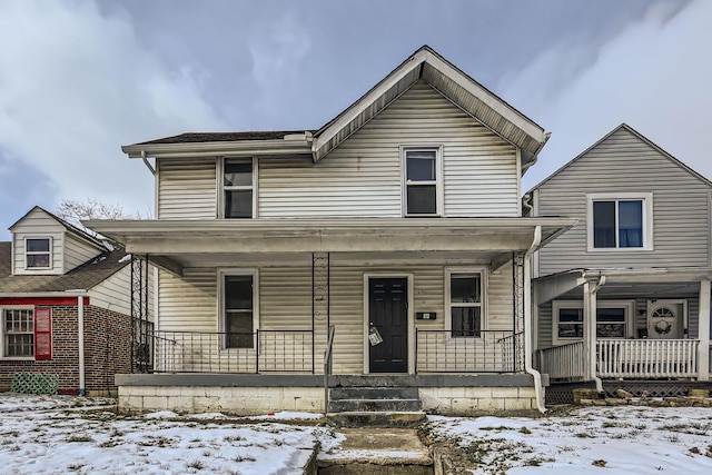 view of property featuring a porch