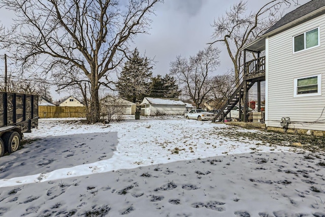 view of yard layered in snow