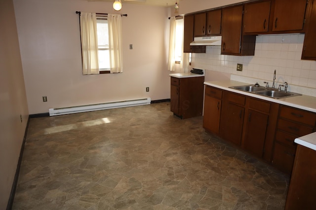 kitchen featuring sink, decorative backsplash, ceiling fan, and baseboard heating