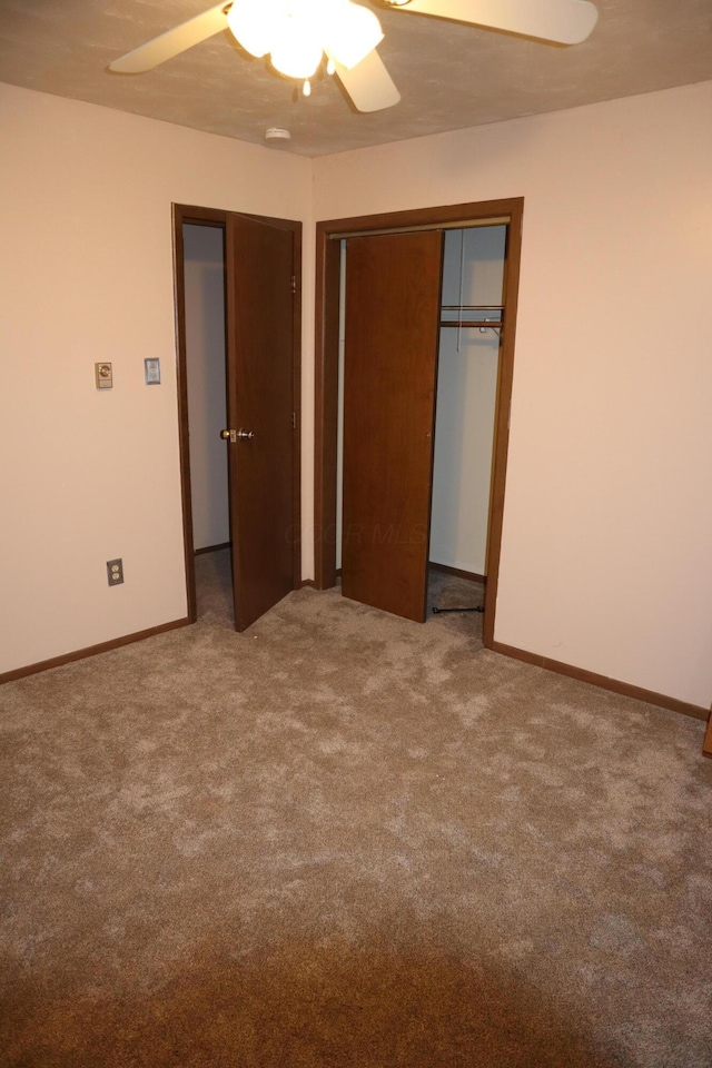 unfurnished bedroom featuring ceiling fan, carpet floors, and a closet