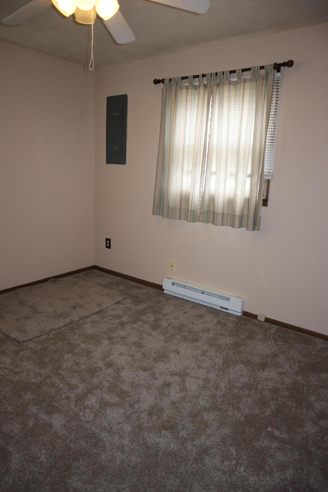 carpeted empty room with ceiling fan, electric panel, and a baseboard heating unit