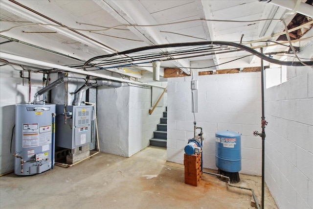 unfinished basement with stairs, heating unit, and water heater