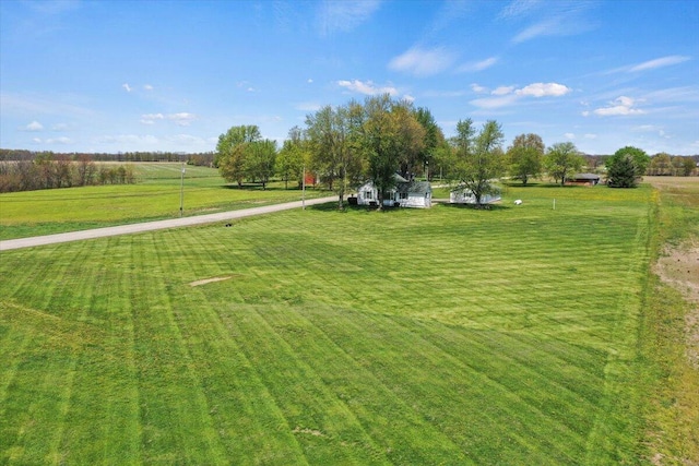 view of yard with a rural view