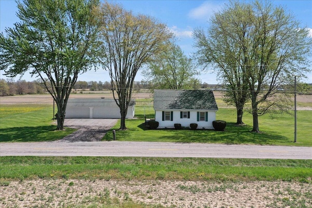 exterior space with a lawn and an outbuilding