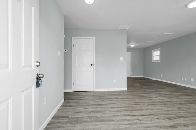 spare room featuring hardwood / wood-style floors