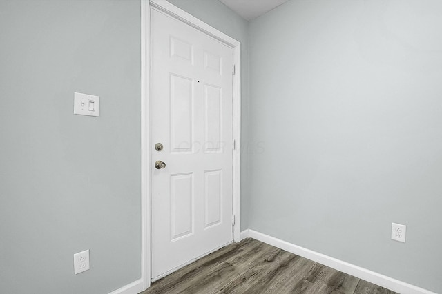 entryway with dark hardwood / wood-style flooring