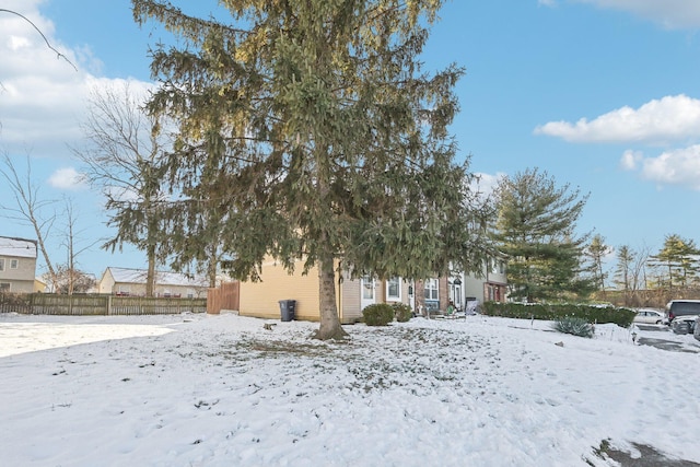 view of yard layered in snow