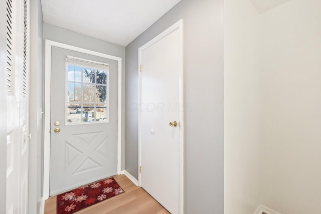 doorway with light hardwood / wood-style floors