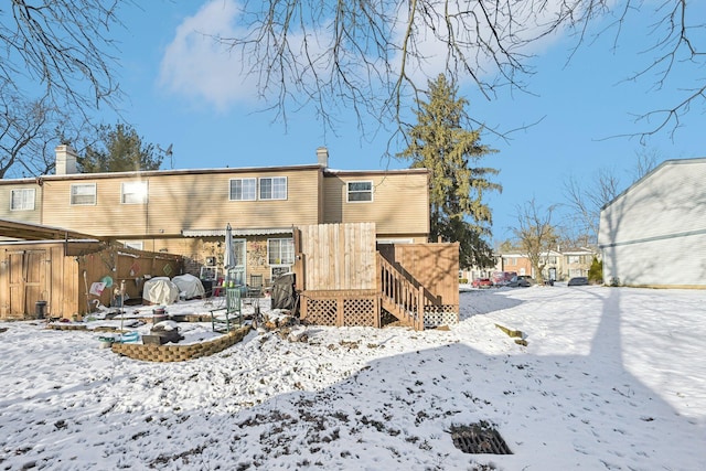 view of snow covered house