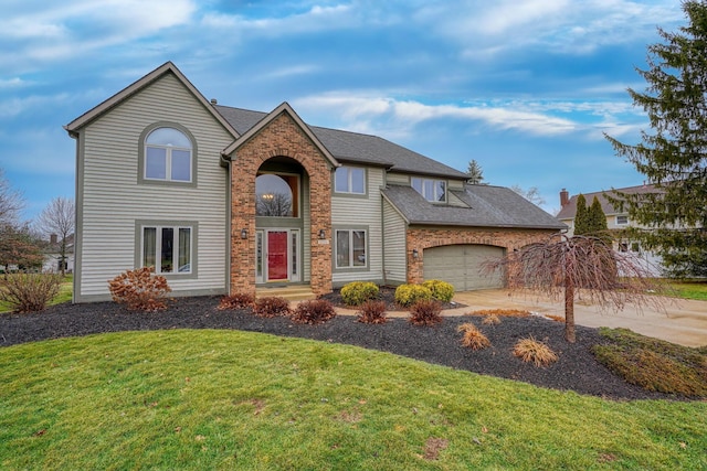 view of front property with a garage and a front lawn