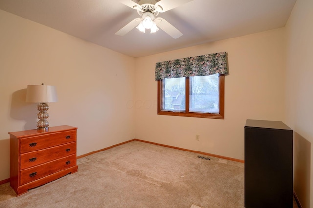 bedroom with ceiling fan and light colored carpet