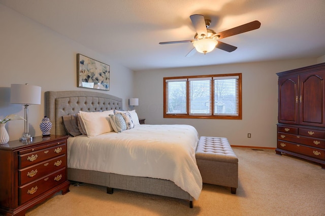 bedroom with light colored carpet and ceiling fan