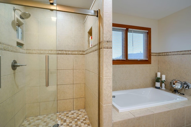 bathroom with separate shower and tub