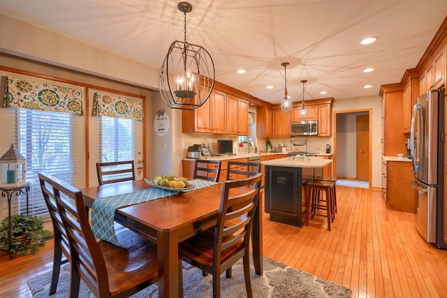 dining space featuring light hardwood / wood-style floors