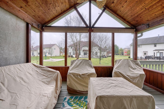 sunroom / solarium featuring lofted ceiling and wooden ceiling