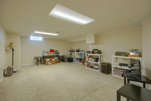 basement with carpet flooring and a drop ceiling