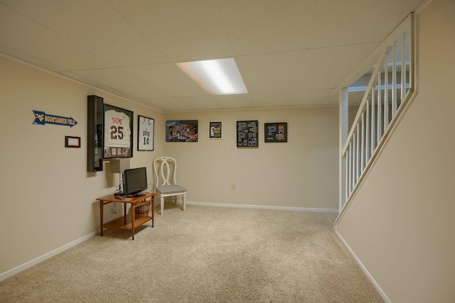 interior space with light carpet and a drop ceiling