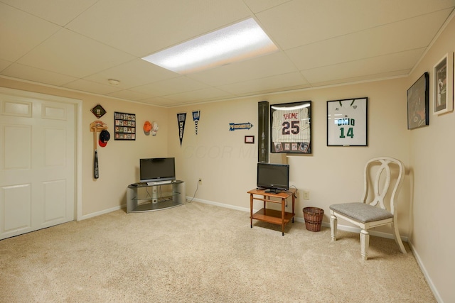 sitting room with carpet flooring and a paneled ceiling