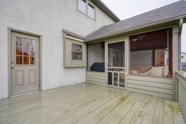 wooden terrace featuring a sunroom