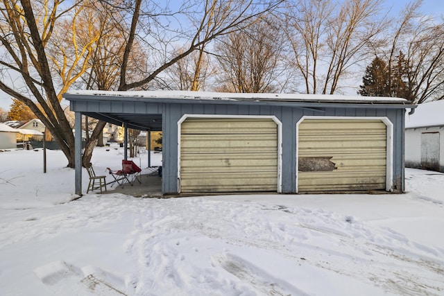 view of snow covered garage