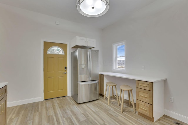 foyer entrance featuring light hardwood / wood-style floors