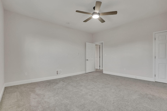 empty room with carpet and ceiling fan