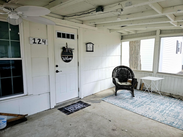 view of exterior entry featuring ceiling fan