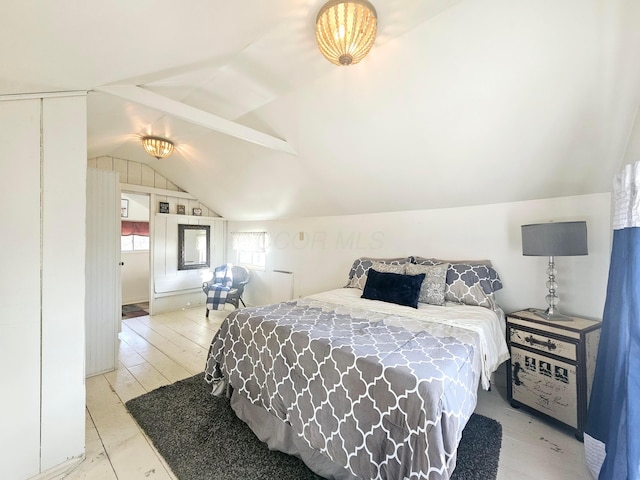 bedroom with lofted ceiling