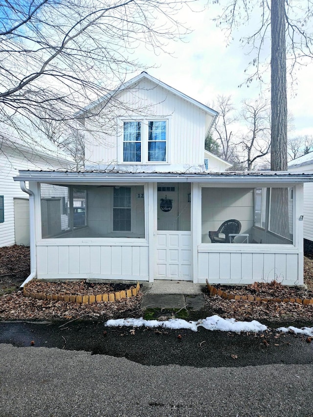 view of front of home with a sunroom