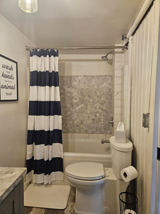 full bathroom featuring toilet, vanity, and shower / bathtub combination with curtain