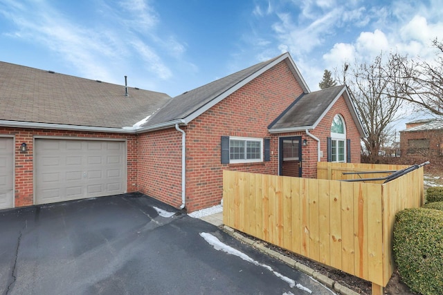 view of property exterior featuring a garage