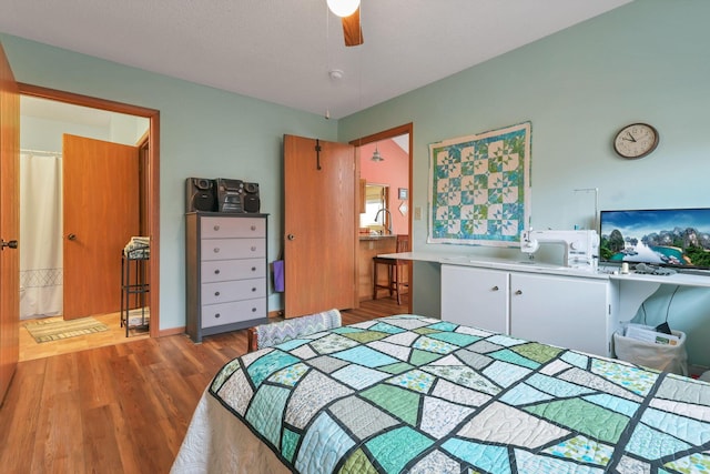 bedroom featuring wood-type flooring and ceiling fan