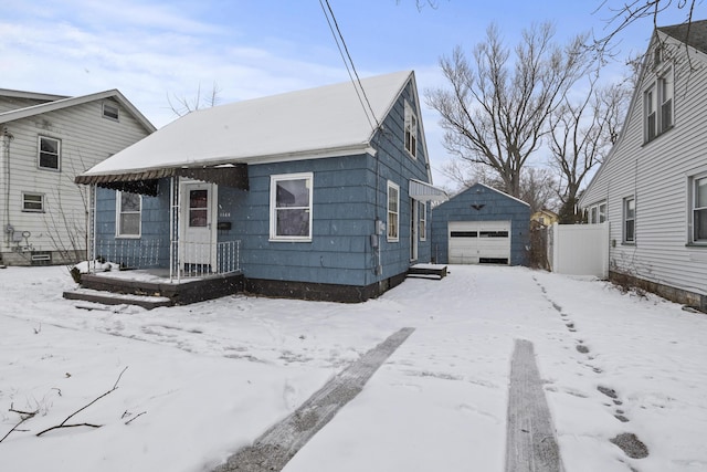 view of front of house featuring a garage and an outdoor structure