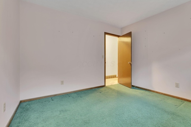 empty room with carpet flooring