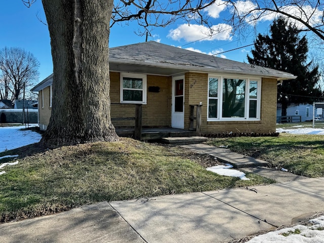 ranch-style home with a front yard