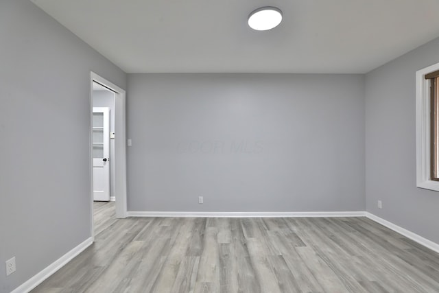 spare room with light hardwood / wood-style floors