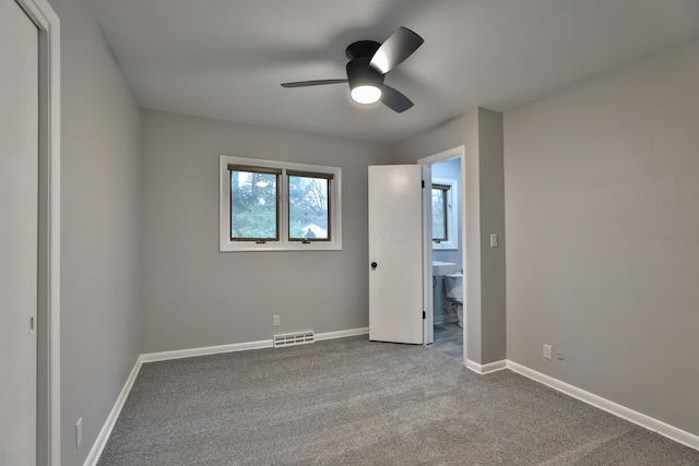 unfurnished bedroom featuring ceiling fan and carpet floors