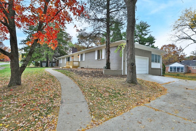 ranch-style home featuring a garage