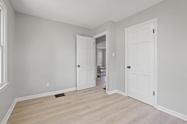 unfurnished bedroom with light hardwood / wood-style flooring