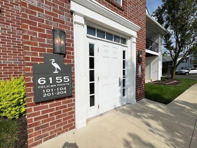 6155 Pelican Pointe Unit 103, Columbus, OH 43231 - doorway to property with brick siding