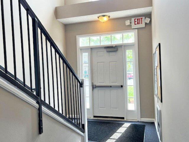 6155 Pelican Pointe Unit 103, Columbus, OH 43231 - foyer with stairway and baseboards